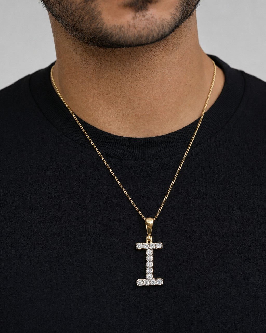 Male model wearing 14k Single Stone Initial I Pendant
