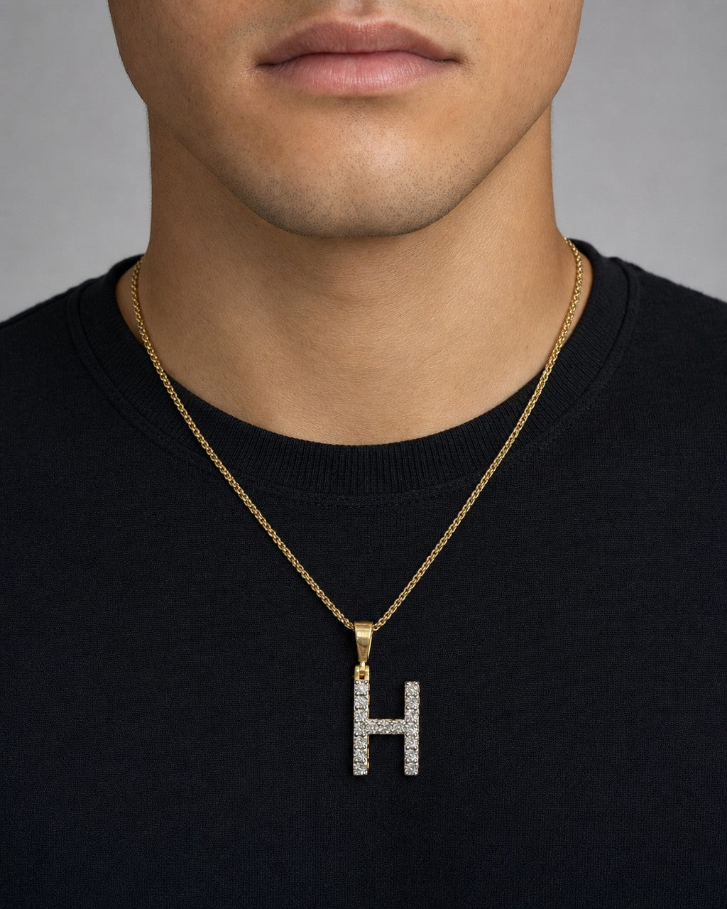 Male model wearing 14k Single Stone Initial H Pendant