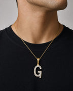 Male model wearing 14K Gold Single Stone Initial G Diamond Pendant