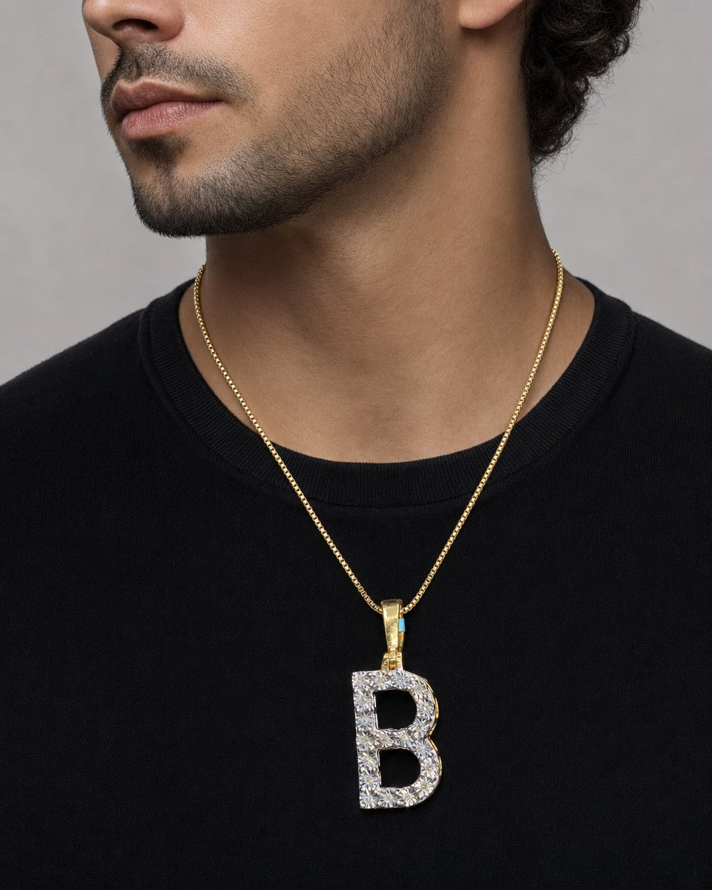 Male model wearing 14k Single Stone Initial B Pendant
