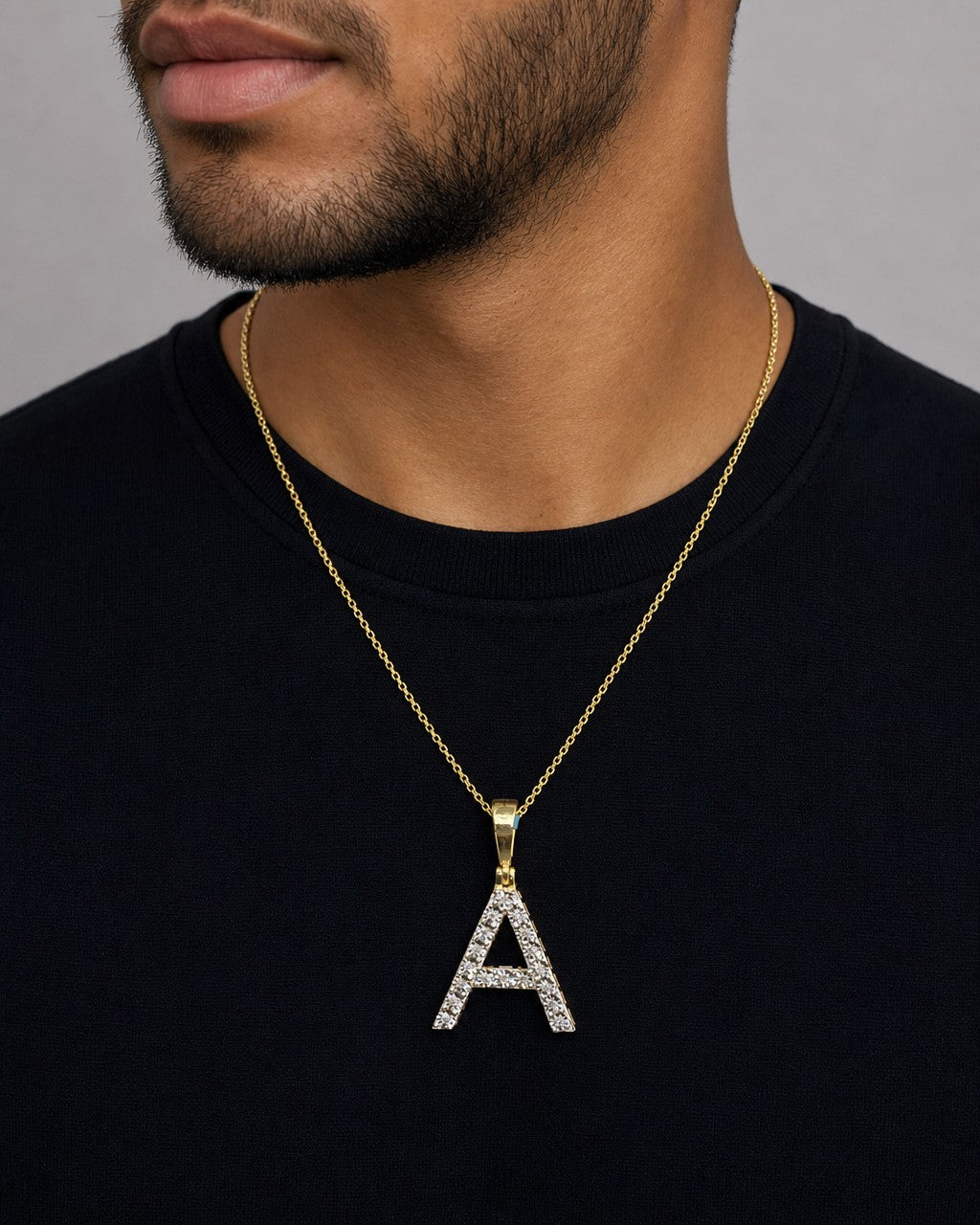 Male model wearing 14k Single Stone Initial A Pendant