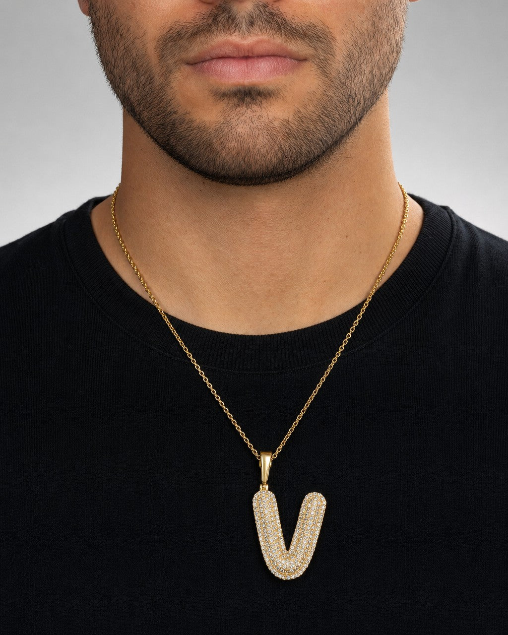 Male model wearing Initial V Bubble Pendant