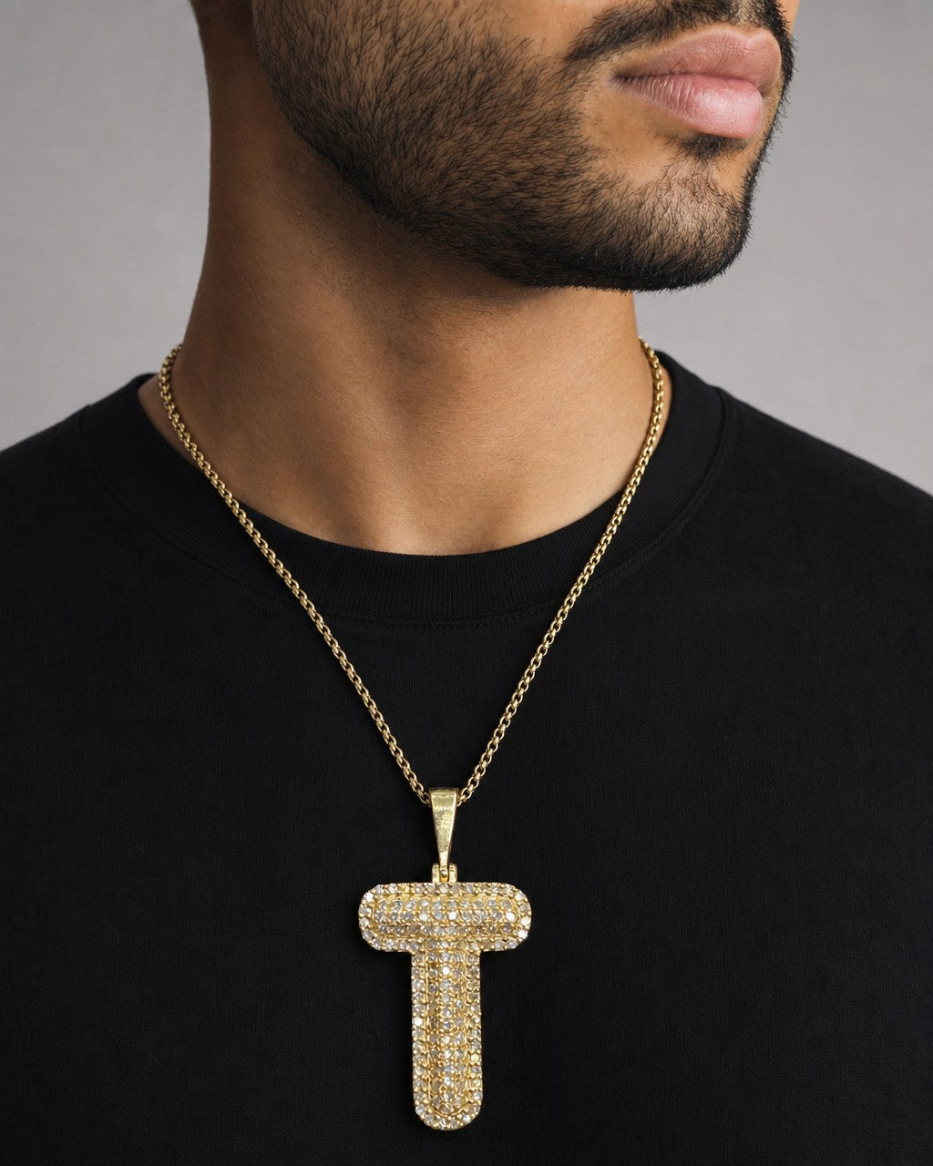 Male model wearing Initial T Bubble Pendant