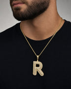 Male model wearing Initial R Bubble Pendant
