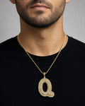 Male model wearing Initial Q Bubble Pendant