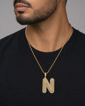 Male model wearing Initial N Bubble Pendant
