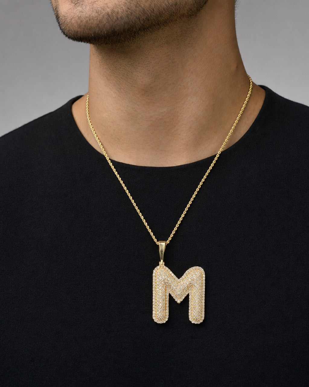 Male model wearing Initial M Bubble Pendant
