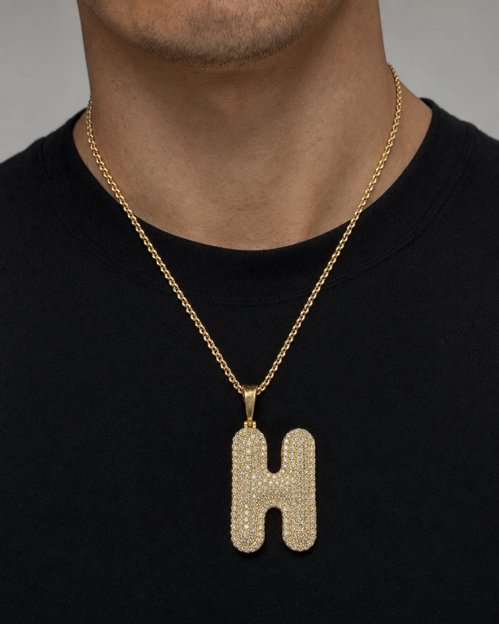 Male model wearing Initial H Bubble Pendant