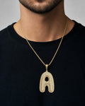 Male model wearing 10K Initial A Bubble Diamond Pendant