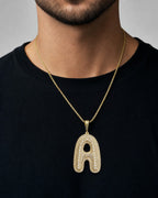 Male model wearing 10K Initial A Bubble Diamond Pendant