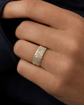 Male model wearing 14K Five Stripe Diamond Baguette Ring