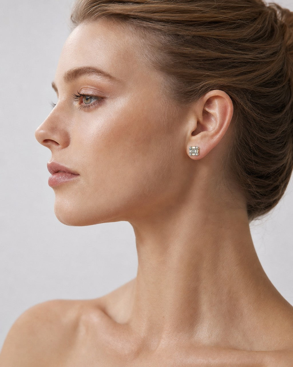 Female model wearing 14K Diamond Baguette Stud Earrings