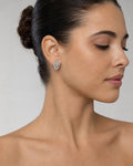 Female model wearing 14K Eye Diamond Baguette Earrings