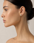 Female model wearing 14K Elite Square Diamond Earrings