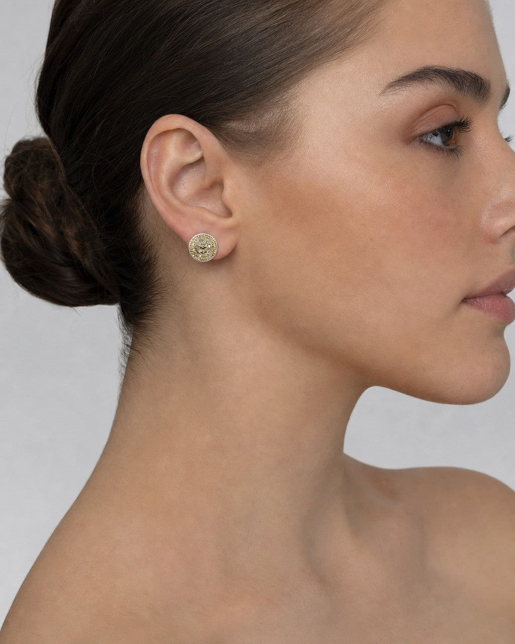 Female model wearing 14K Circle Flat Diamond Earrings
