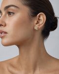 Female model wearing 14K Castle Diamond Earrings Jumbo