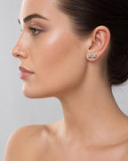 Female model wearing 14K Castle Diamond Earrings Large