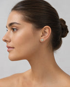 Female model wearing 14K Circle Flower Diamond Earrings