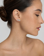 Female model wearing 14K Flower Stud Diamond Earrings