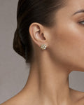 Female model wearing 14K Flower Diamond Earrings 1.4ct