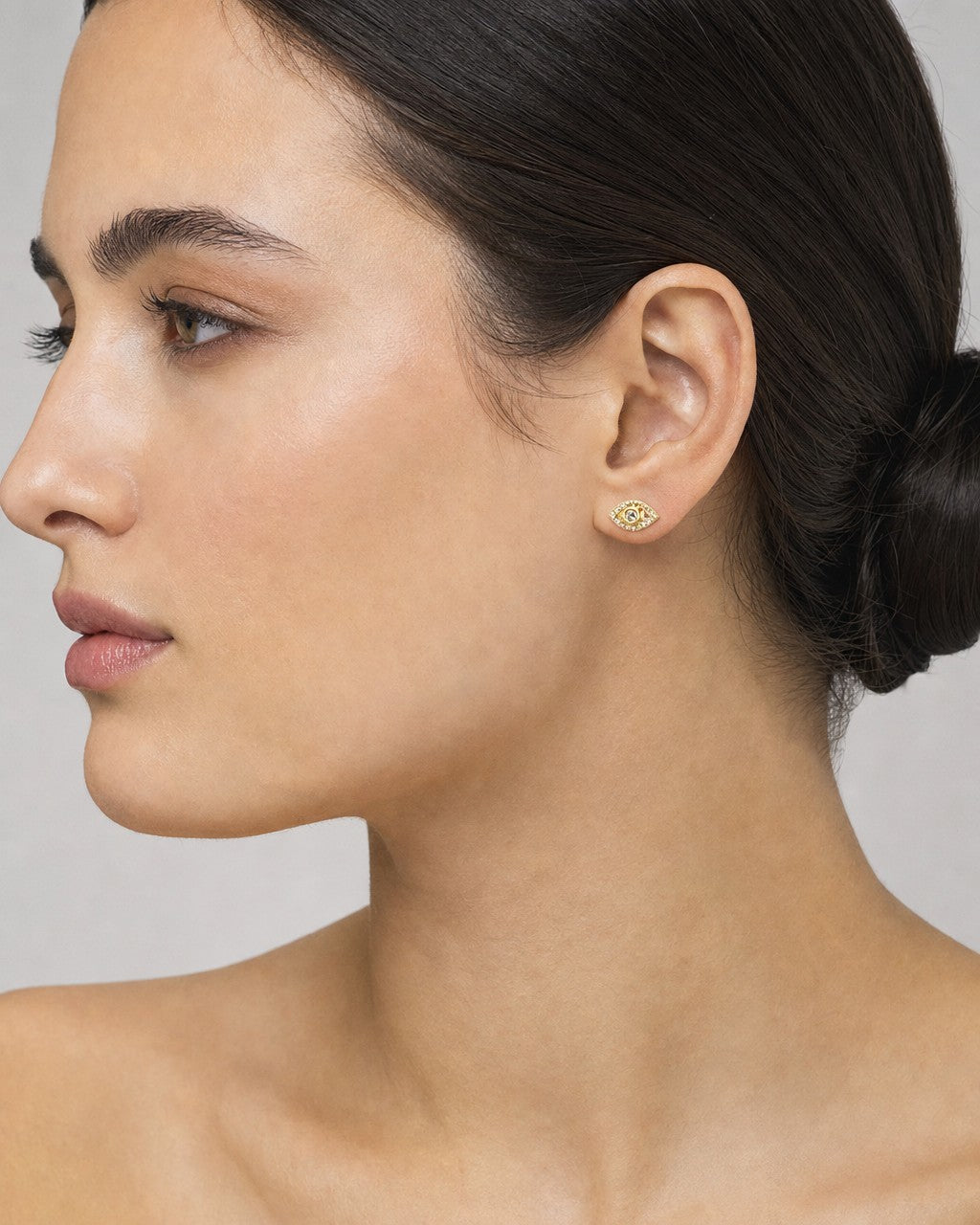 Female model wearing 14K Eye Diamond Earrings