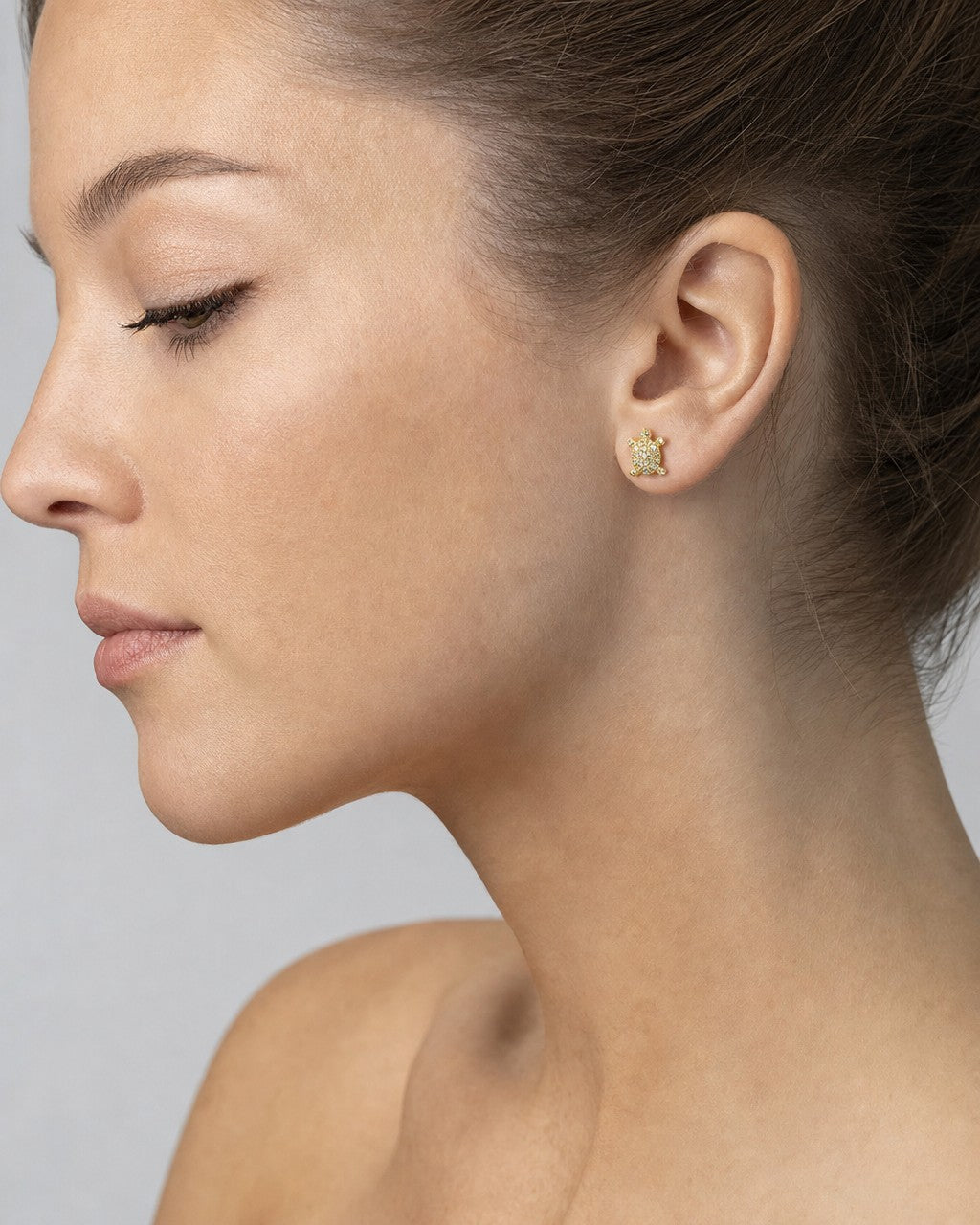 Female model wearing 14K Turtle Diamond Earrings
