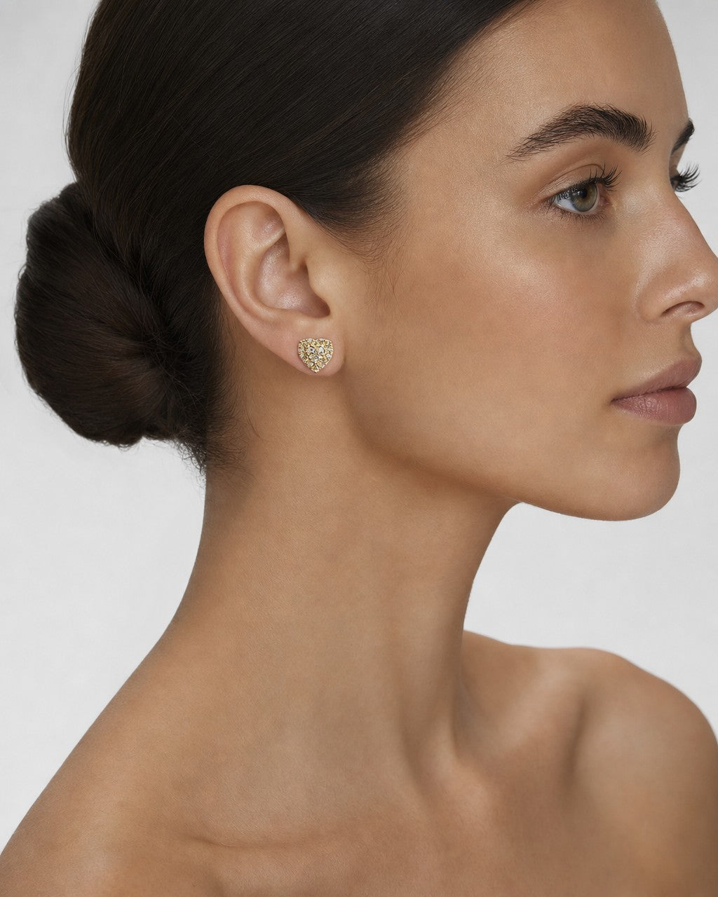 Female model wearing 14K Royal Heart Diamond Earrings