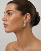 Female model wearing 14K Jesus Head Earrings 0.5"