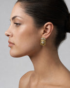 Female model wearing 14K Jesus Head Earrings 0.8"