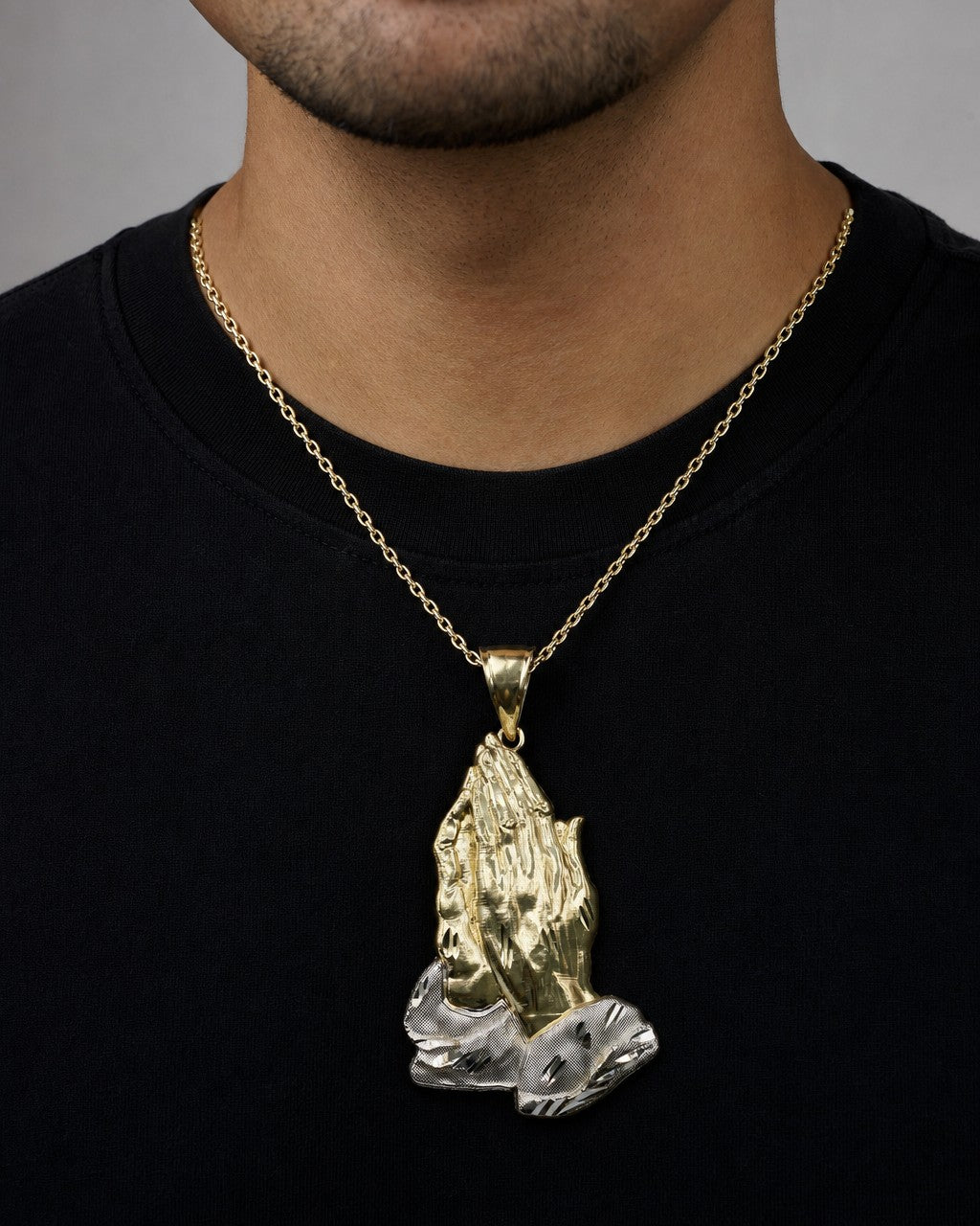 Male model wearing 14K Praying Hands Pendant 2.6"