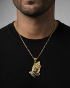 Male model wearing 14K Praying Hands Pendant 1.2"