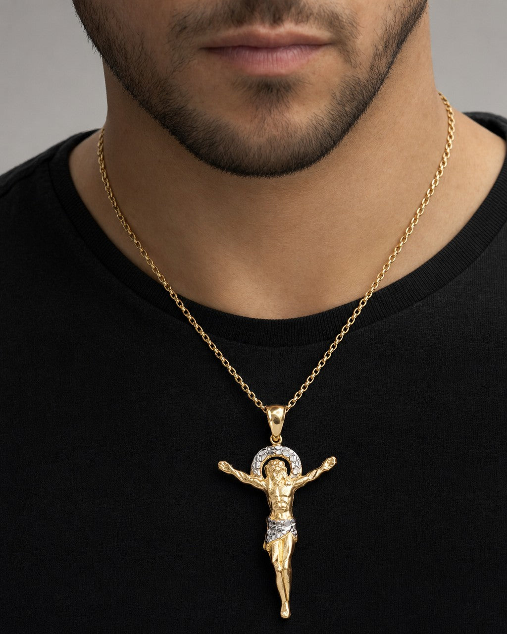 Male model wearing 10K Crucified Jesus Pendant 2.2"