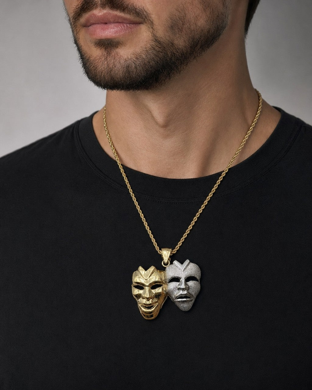 Male model wearing 10K Laugh Now Cry Later Pendant 1.4"