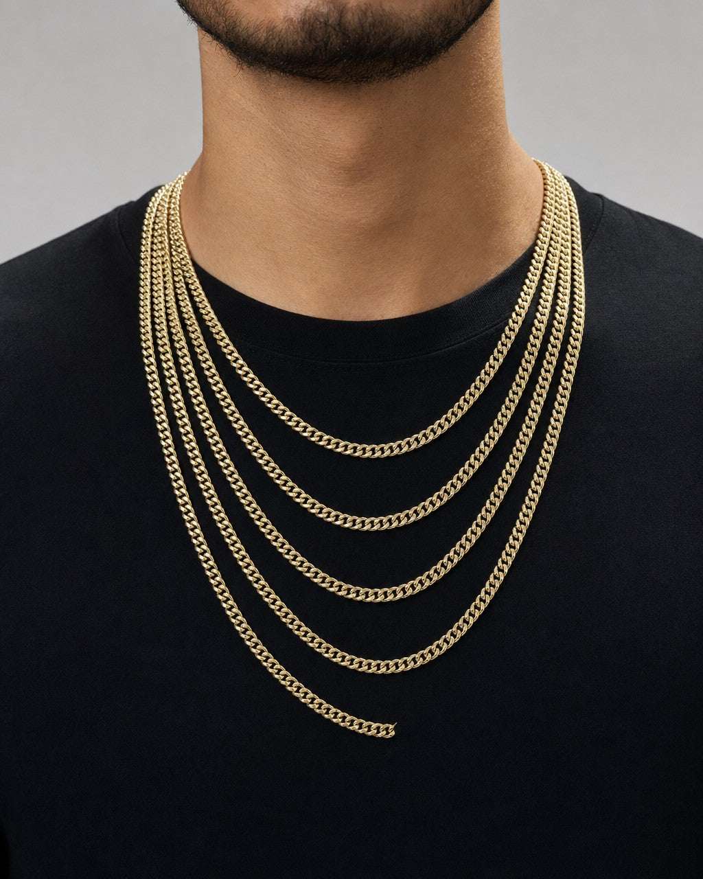 Male model wearing 14K Gold 5MM Miami Cuban Link Chain 18-26”