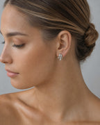 Female model wearing 14K Crystal Diamond Baguette Earrings