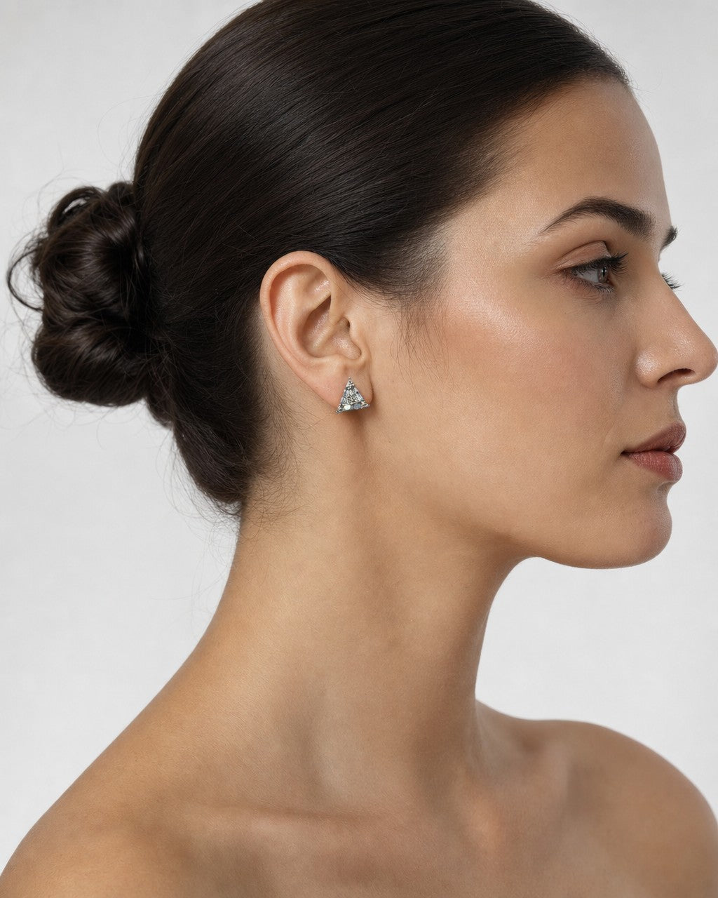 Female model wearing 14K Equilateral Triangle Diamond Baguette Earrings