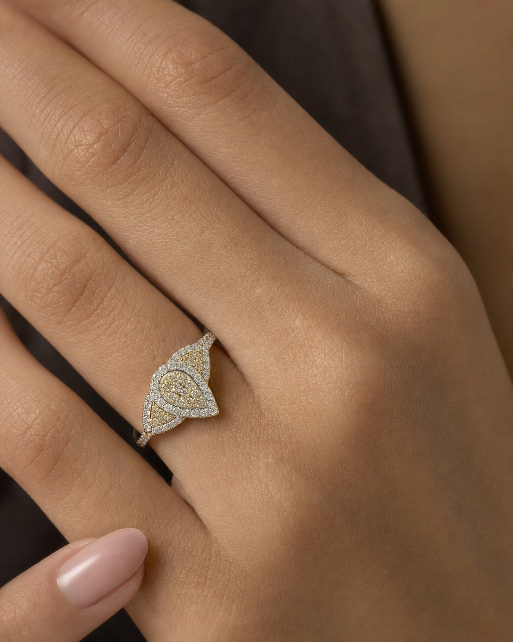 Female model wearing 14K Tri-stone Pear Shape Diamond Engagement Ring