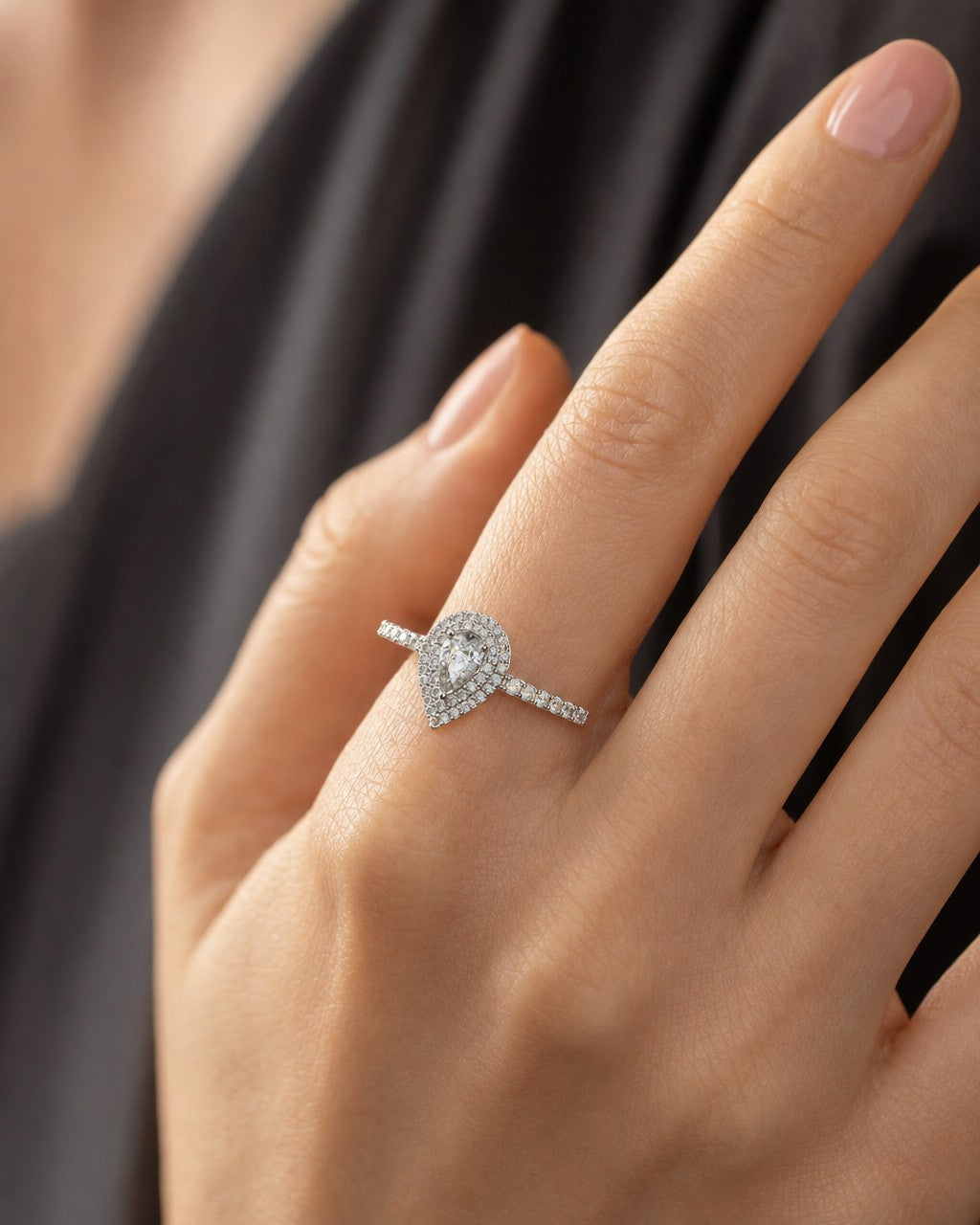 Female model wearing 14K Pear Shape Large Center Stone Diamond Engagement Ring
