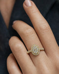 Female model wearing 14K Oval Diamond Engagement Ring