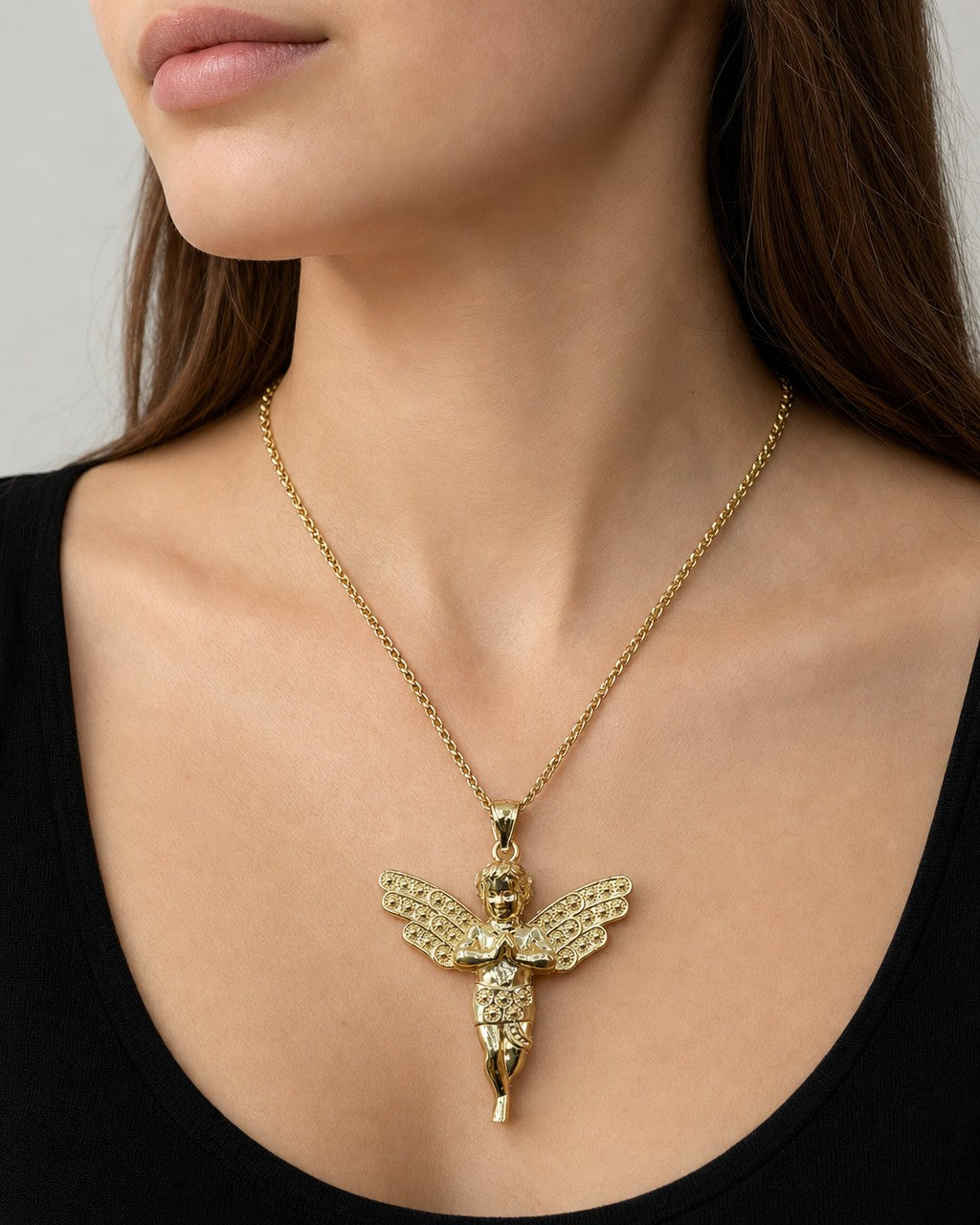 Female model wearing 14K Baby Angel Pendant 1.25"
