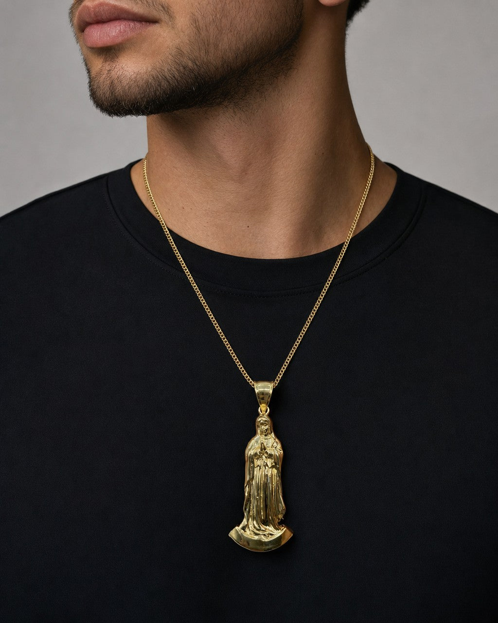 Male model wearing 14K Virgin Mary Pendant