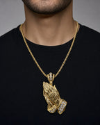 Male model wearing 14K Praying Hands Pendant 2.5"