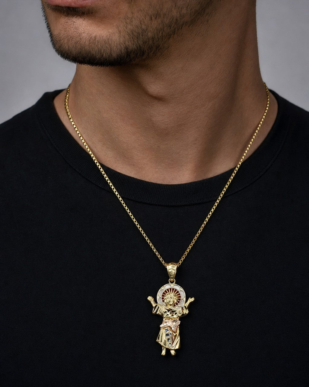 Male model wearing 14K Jesus Save Us Pendant
