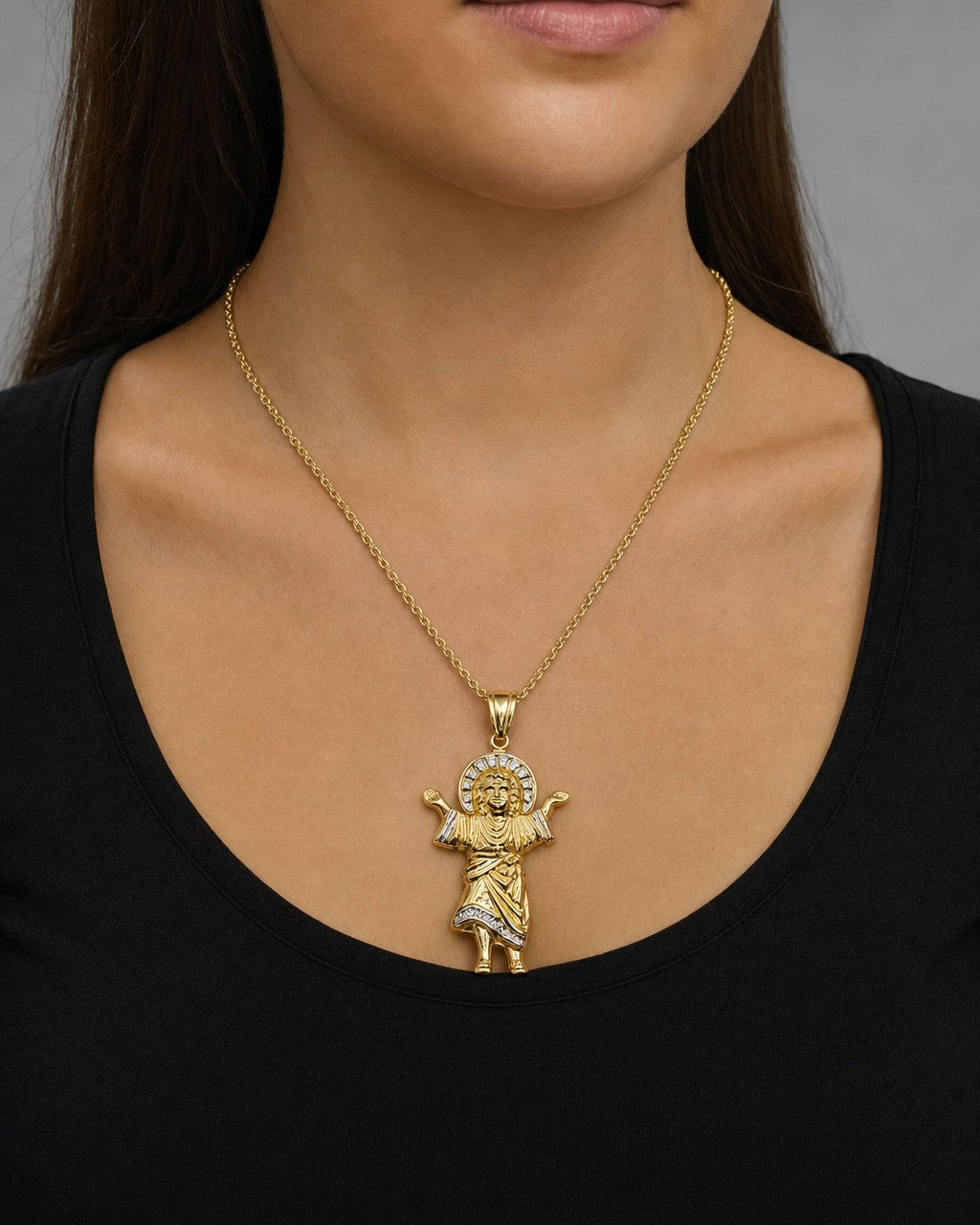 Female model wearing 14K Baby Jesus Pendant