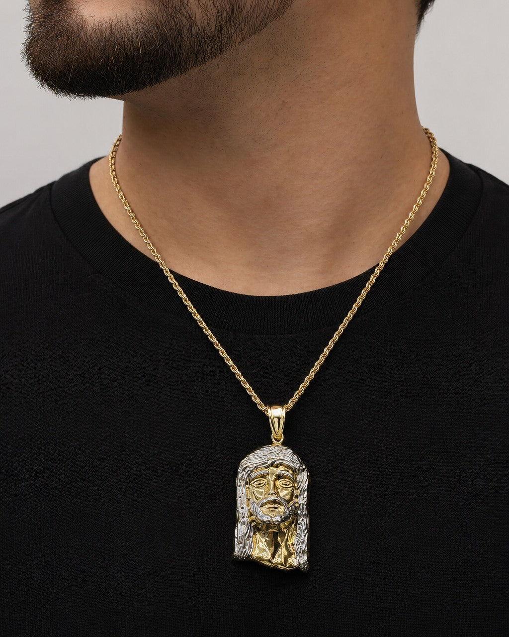 Male model wearing 14K Jesus Head Pendant