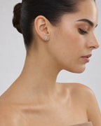Female model wearing 14K Snowflake Diamond Earrings