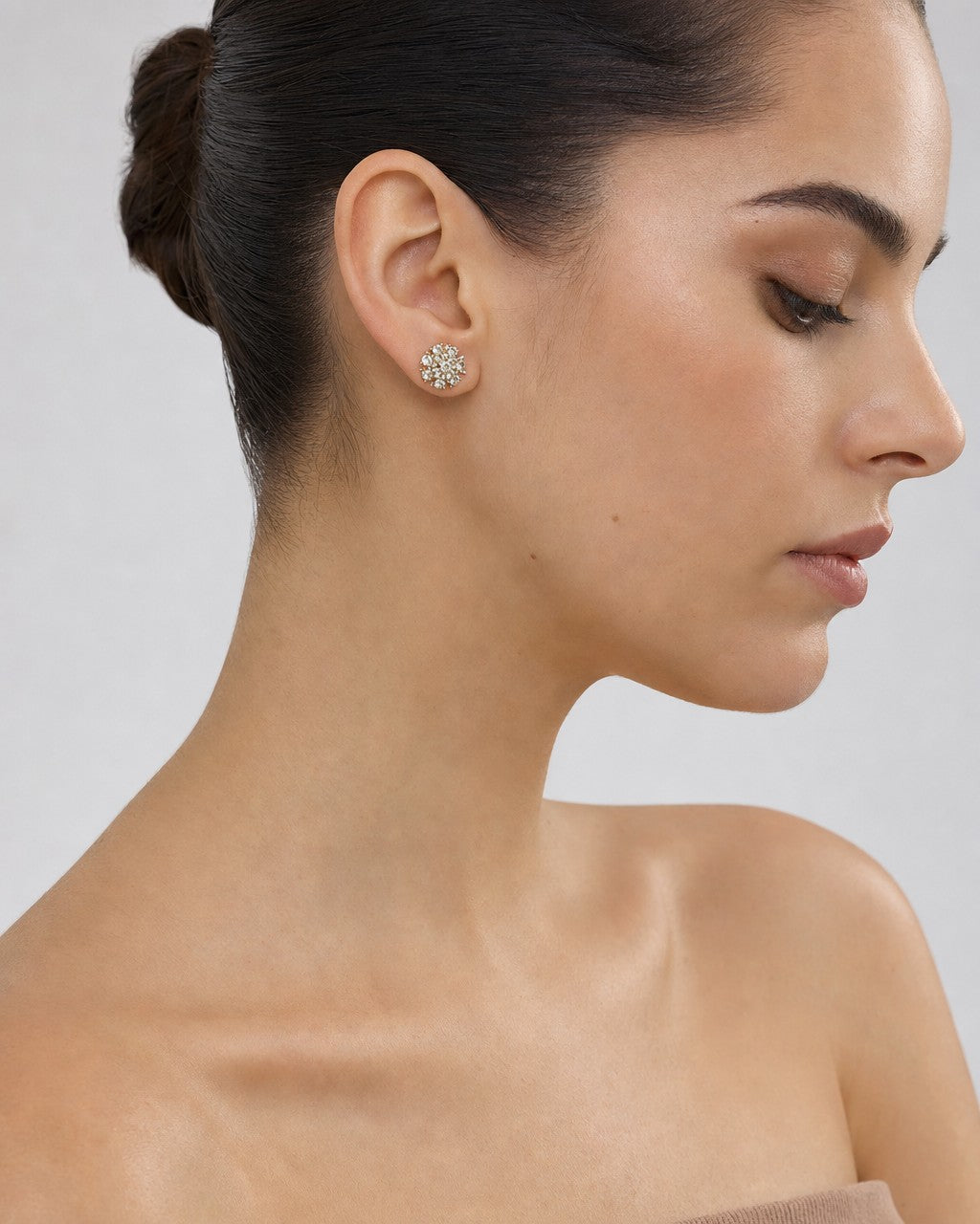 Female model wearing 14K Snowflake Diamond Earrings