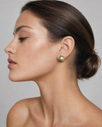 Female model wearing 14K Diana Circle Diamond Baguette Earrings