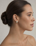 Female model wearing 14K Elias Rectangle Diamond Baguette Earrings