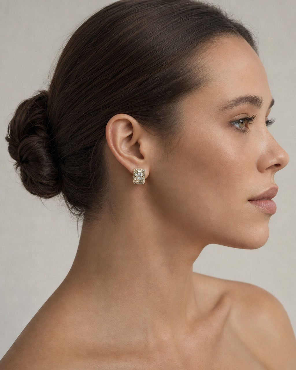 Female model wearing 14K Elias Rectangle Diamond Baguette Earrings